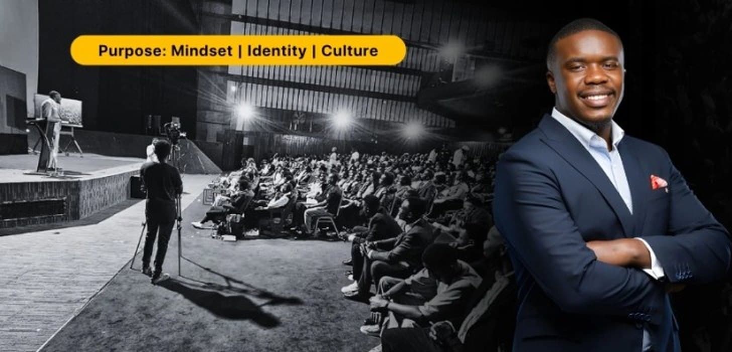 Walubengo speaking to a full auditorium